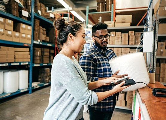 Woman and man in warehouse