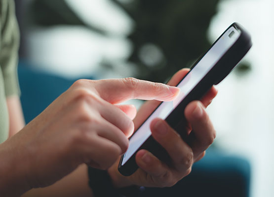 Hands with Cell Phone Dialing